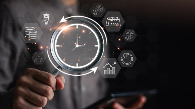 A person using a magnifying glass to focus on a clock with surrounding icons of data, planning, and global connectivity, symbolizing digital time management, analysis, and strategic optimization. - Powered by Adobe