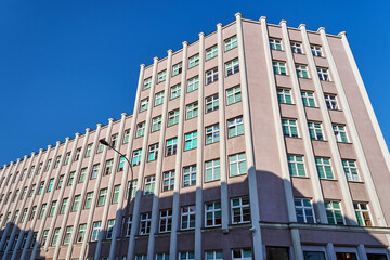 The facade of a modernist office and residential building in Poznan