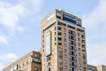 Modern Residential Apartment Building with Balconies and Large Windows