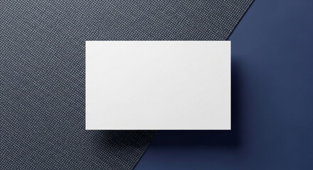 Mockup of a business card on a dark textured background resembling carbon fiber or fabric. A modern and minimalist template for masculine or tech branding.