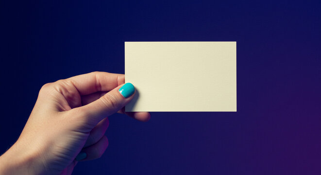 A woman's hand holds a blank card against a solid dark blue background. A simple, elegant, and professional mockup for corporate branding or invitations.