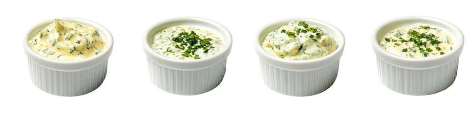 Four ramekins of creamy dips with green herbs
