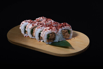 Delicious Japanese sushi set with nigiri, maki rolls, and soy sauce served on a wooden board. Traditional Asian cuisine concept.