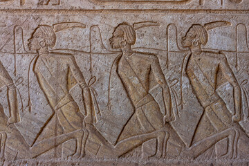 Ancient wall relief depicting procession, Abu Simbel Temple, Egypt
