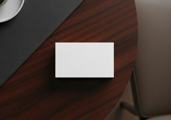 Mockup of a white business card on a dark wood desk. A clean, professional, and minimalist template for corporate, legal, or executive branding presentations.