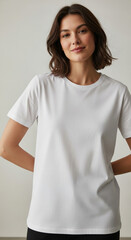 A woman wearing a blank white t-shirt against a neutral background. A clean, simple, and minimalist lifestyle mockup for apparel branding and print designs.