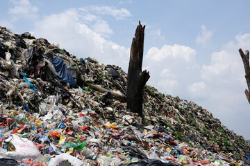 A Massive Mountain of Garbage and Plastic Waste at an Open Landfill Site