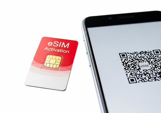 eSIM activation card next to smartphone displaying QR code  