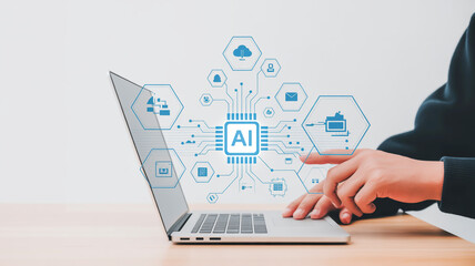 Person's hands using laptop with AI chip graphic and digital icons on white background artificial intelligence