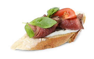 Delicious bruschetta with roast beef, cream cheese, tomato and basil isolated on white