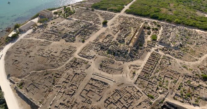 Aerial view of the archaeological site of Selinunte, located in province of Trapani, Sicily, Italy. At the center of the archaeological park is the Temple of Apollo. It overlooks the Mediterranean sea