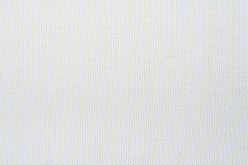 Sweater or scarf fabric texture large knitting. Knitted jersey background with a relief pattern. Wool hand- machine, handmade.