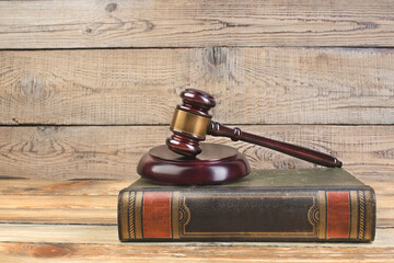 Judge gavel on the book on wooden table. justice and law concept.