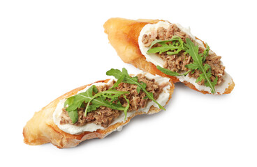 Delicious bruschettas with tuna, cream cheese and arugula isolated on white, top view