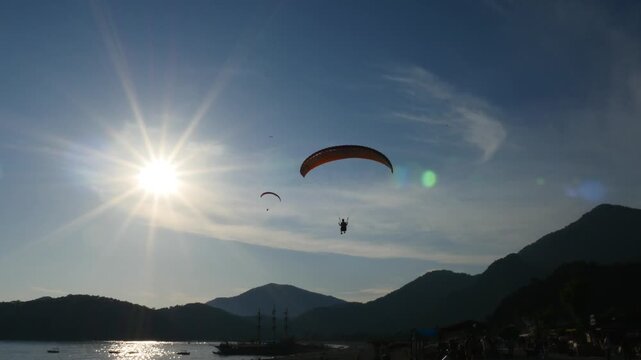 paragliding clouds sunset dusk fethiye blue lagoon oludeniz famous tourism place babadag 