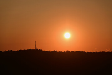 Fototapeta premium Scenic sunset over Gubalowka, Zakopane, Poland. View of the slope of Gubalowka with its characteristic tower - The Zakopane-Gubałowka transmitter, a facility for FM and TV transmission