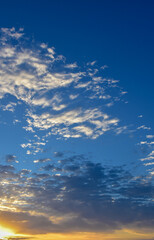 Bright Blue Sky with Whispers of White Clouds
