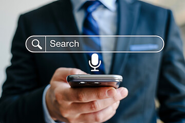 Voice search on smartphone for business man using mobile search app for online information access now