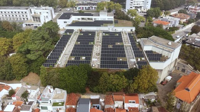 Drone Shot of Solar Panels Array in Suburbs of Porto, Portugal Under Morning Fog From Atlantic Ocean