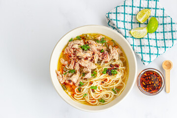 Chicken Noodle Soup in Bowl – Comfort Food with Vegetables and Fresh Herbs
