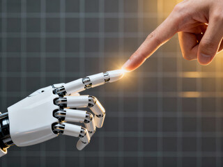 Human hand touching robotic hand representing human-machine interaction