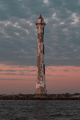 Fototapeta premium Rear Lighthouse of the Sea Canal in Kronstadt at Sunset
