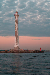 Fototapeta premium Rear Lighthouse of the Sea Canal in Kronstadt at Sunset