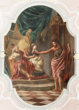 BAD REICHENHALL, GERMANY - SEPTEMBER 8, 2025: The fresco of St. John the Baptist denouncingunion of Herod and Herodias in the church St. Johannes Spitalkirche Leonhard Thoma from beginn of 20. cent. 
