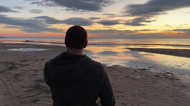 Man walks on the sea cost and fells freedom
