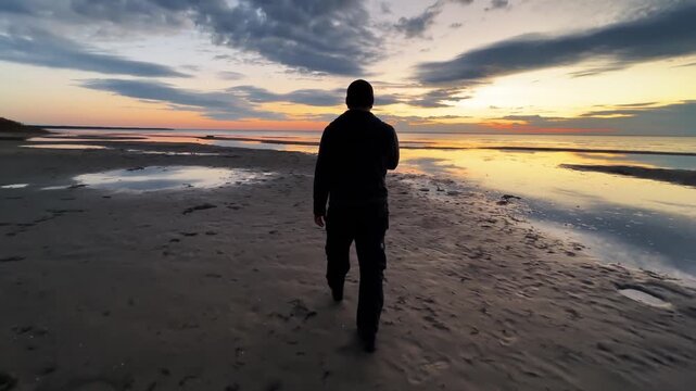 Man walks on the sea cost and fells freedom