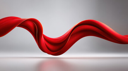 Red flowing fabric with smooth curves and elegant movement on soft gray background, creating dynamic and graceful visual effect