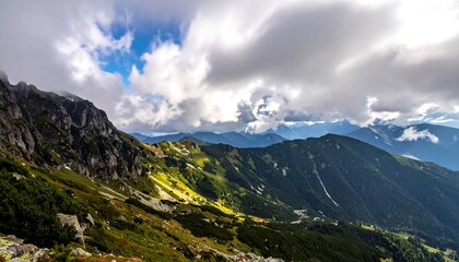 Majestic mountain landscape, cloudy sky, rocky peaks, and verdant slopes