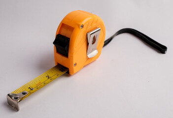 Yellow Tape Measure on White Background