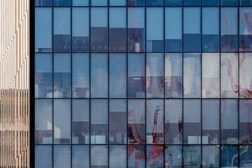 Fototapeta premium Geometric Grid of Blue Glass Windows with Abstract Reflections