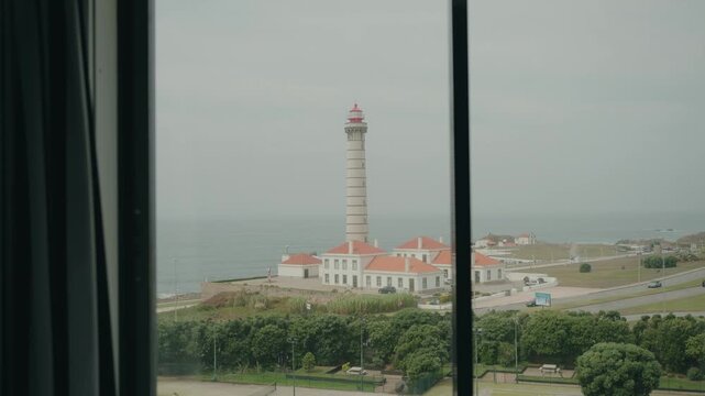 coastal view of farol de le&ccedil;a lighthouse by the atlantic ocean in porto