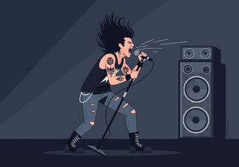 Rock singer with tattoos performs into a microphone with speakers nearby.