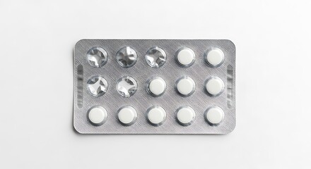 A blister pack containing white and translucent oval shaped pills