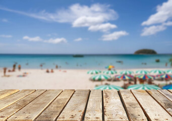Wooden table top on the beach or sea.Party on the beach  sunshine time concept.For montage product display or design key visual layout.View of copy space.