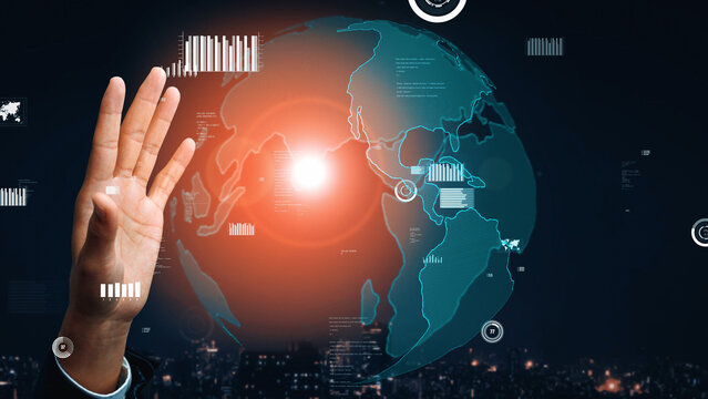 A technology-driven image depicting a hand interacting with a digital globe filled with data analytics. The vibrant light and city backdrop enhance the modern theme. Xenic