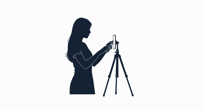Silhouette of a woman adjusting a smartphone mounted on a tripod, preparing to record or take a photo.