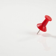 Close-up of red push pin on pure white background, stationary, design, pin