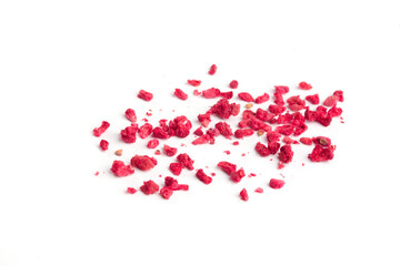pieces of dried raspberries on a white background