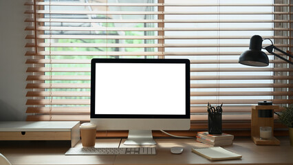 Computer empty screen on home office workspace