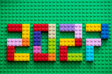 Naklejka premium The numbers 2027 are laid out from multi-colored Lego bricks