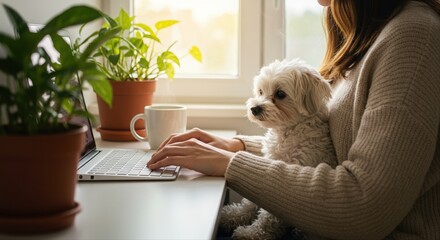 young woman working from home with laptop and dog by window, cozy atmosphere and plants