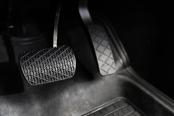 The driver checks the car's brakes every time before a long journey for safety.