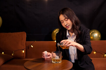 Closeup business woman holding a glass of whiskey