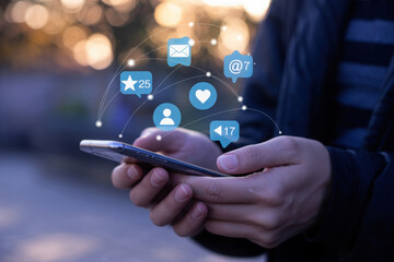 Hands holding smartphone with social media icons and network