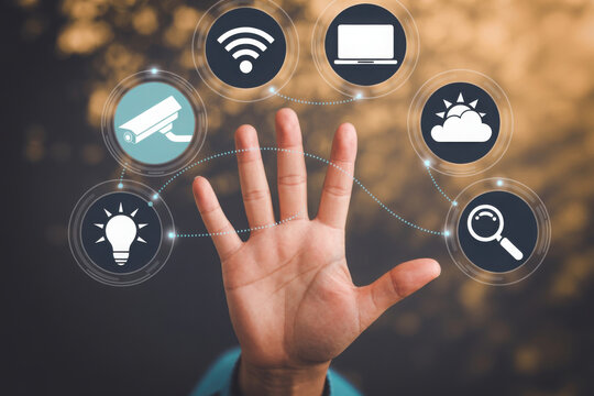 Open hand displaying icons for smart home technology and connectivity