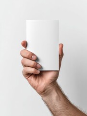 Bifold Paper Brochure Mockup in Hand Over White